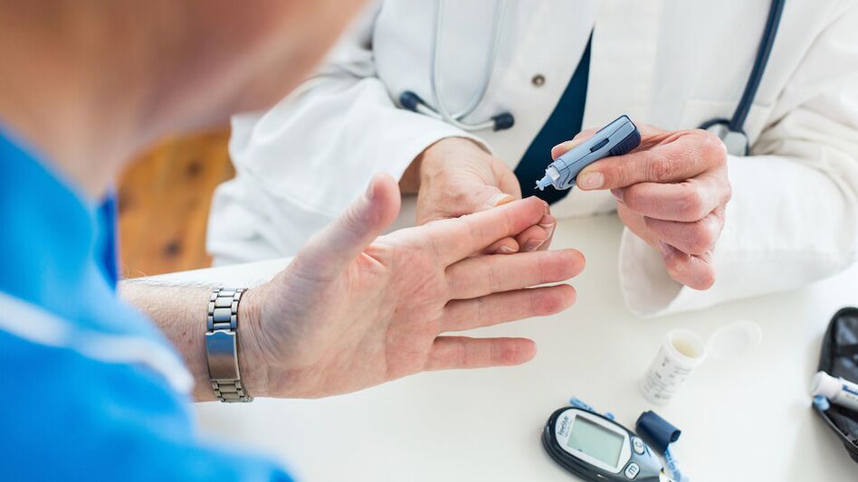 the doctor takes blood for sugar in diabetes